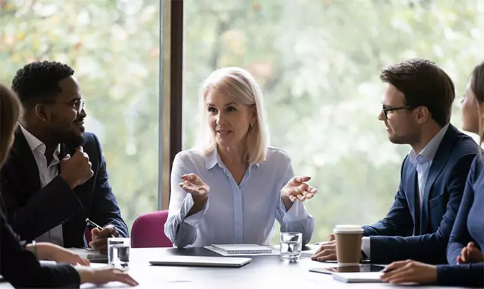 woman leading business meeting